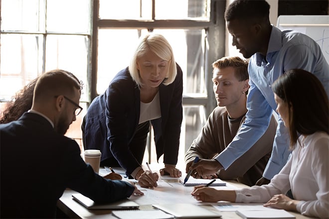 A group of workers strategizing their next move.